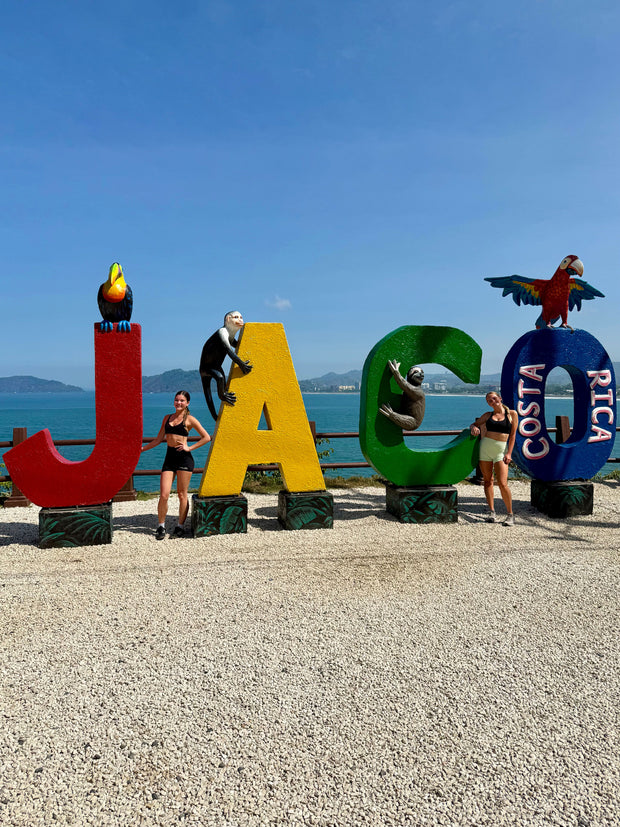 Visitors in front of Jaco Costa Rica sign