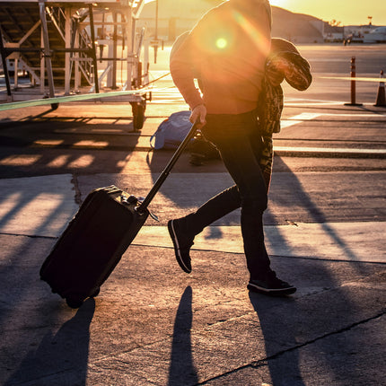 Running with luggage to catch a flight