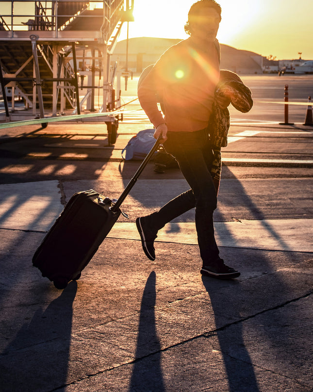 Running with luggage to catch a flight