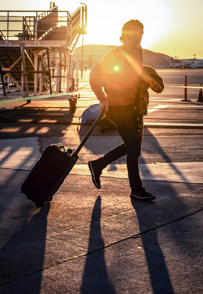 Running with luggage to catch a flight